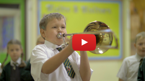 Young girl playing the trombone with YouTube icon overlaid on image